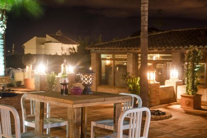 Villa CONMIGO evening outside bar table